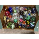 A large box of paperweights, large and small, diff