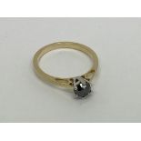 An 18ct gold ring set with a black diamond approx