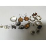 A collection of silver jewellery including earring