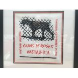 A framed Guns n Roses and Metallica concert poster for a show at Oakland Stadium on September