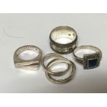 Four silver rings of various design (4)