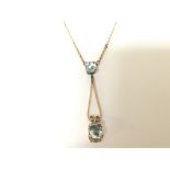 A 9carat gold necklace set with aquamarine drop pe
