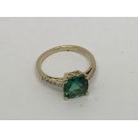 A 14ct gold ring set with a tourmaline and diamond