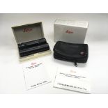 A pair of Leica binoculars (10 x 25) in a fitted case.