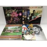 A collection of Hall and Oates LPs and 12 inch singles.