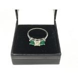 A 14k gold diamond and emerald ring, approx 3.5g a