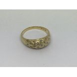 An 18ct gold ring set with 18 small diamond cluste