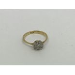 A vintage 18ct gold ring set with 7 diamond shaped