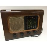 A vintage walnut cased PYE radio.