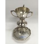 A silver travelling communion set.