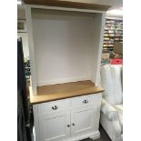 A modern white painted oak dresser with a raised back with three adjustable shelfs above two drawers