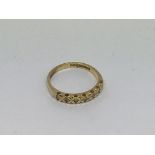 An 18ct gold half eternity ring set with 7 diamond