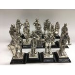 A collection of 14 Royal Hampshire art foundry fig