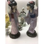 A collection of Lladro and Doulton figures includi