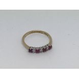 A 9ct gold ring set with 4 Ruby’s and 3 diamonds.