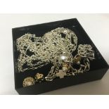 A box containing silver necklaces bracelets and ea