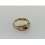 A antique 18ct gold ring set With a sapphire and d
