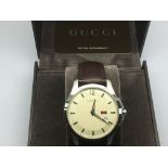 A boxed Gucci gents dress watch.