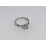 A 9ct white gold ring set with a moissanite. Size