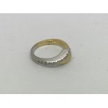 An 18ct white and yellow gold ring set with 10 dia
