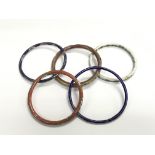 Five narrow enamel bracelets.