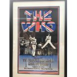 A framed poster of The Who announcing their induction in to the rock and roll hall of fame on