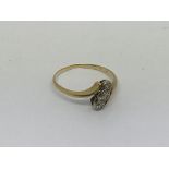 A 1930s gold ring set with 3 diamonds approx 0.25c