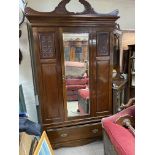 A large walnut mirror fronted single door wardrobe.