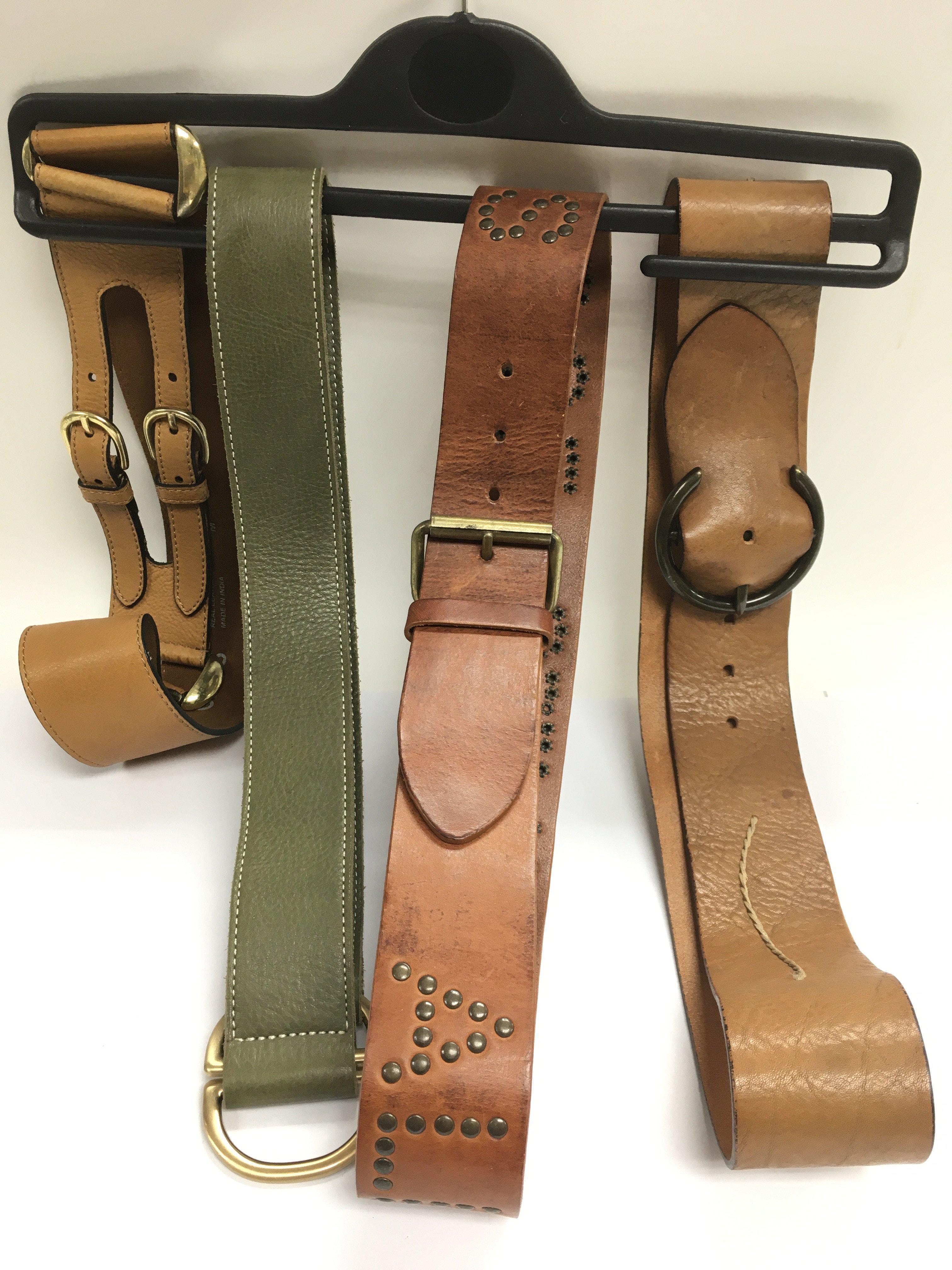 Four designer leather belts comprising Ted Baker,