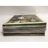 A collection of LPs by various artists including The Byrds, Queen, The Pretenders etc.