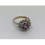 A 14ct gold ring set with ruby and diamond cluster