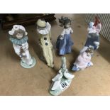 A collection of six Lladro and Nao figures