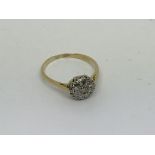 A vintage 18ct gold ring set with diamond cluster