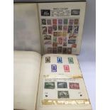 Two albums of GB and world stamps.