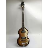 A Jay Turser 'Beatle bass' guitar in the famous McCartney Hofner Violin body shape. Comes supplied