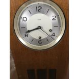 A walnut wall clock the silvered dial with Arabic