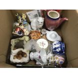 A box of various ceramics.