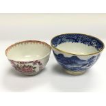 Two tea bowls, one having handpainted floral decoration on a white ground, approx diameter 7.5cm,
