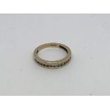 A 9ct gold half eternity ring set with diamonds ap