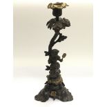 A Victorian bronze figural candlestick in the form