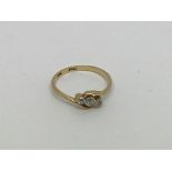 An 18ct gold ring set with 3 diamonds approx 0.10c