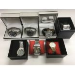 Seven boxed gents watches, various makes including