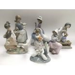 Five Lladro and two Nao figures of children and an