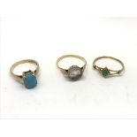 1 antique gold ring set with a rock Crystal intaglio, and 2 gold and turquoise set rings.