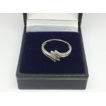 An 18ct white gold ring set with small diamonds, a