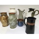 A collection of Doulton stoneware vases and other