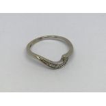 A 9ct white gold ring set with small diamonds. Siz