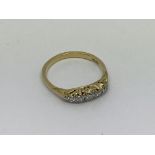 An 18ct gold ring set with 5 diamonds approx 0.25c