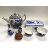 A small collection of blue and white ceramics comprising a teapot, bud vase, box and cover etc