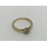 A 9ct gold ring set with 7 diamonds approx 0.10ct.